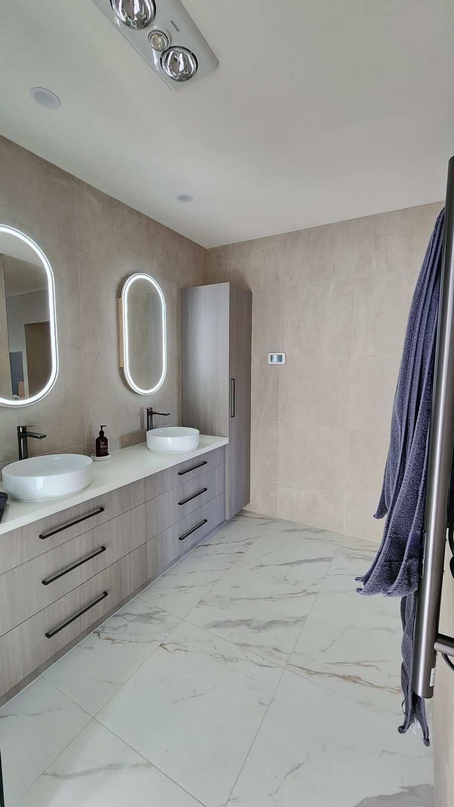 Marble-look porcelain floor tile with grey and caramel veining