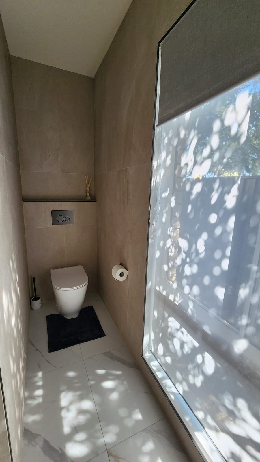 Matte black flush plate and in-wall cistern fittings