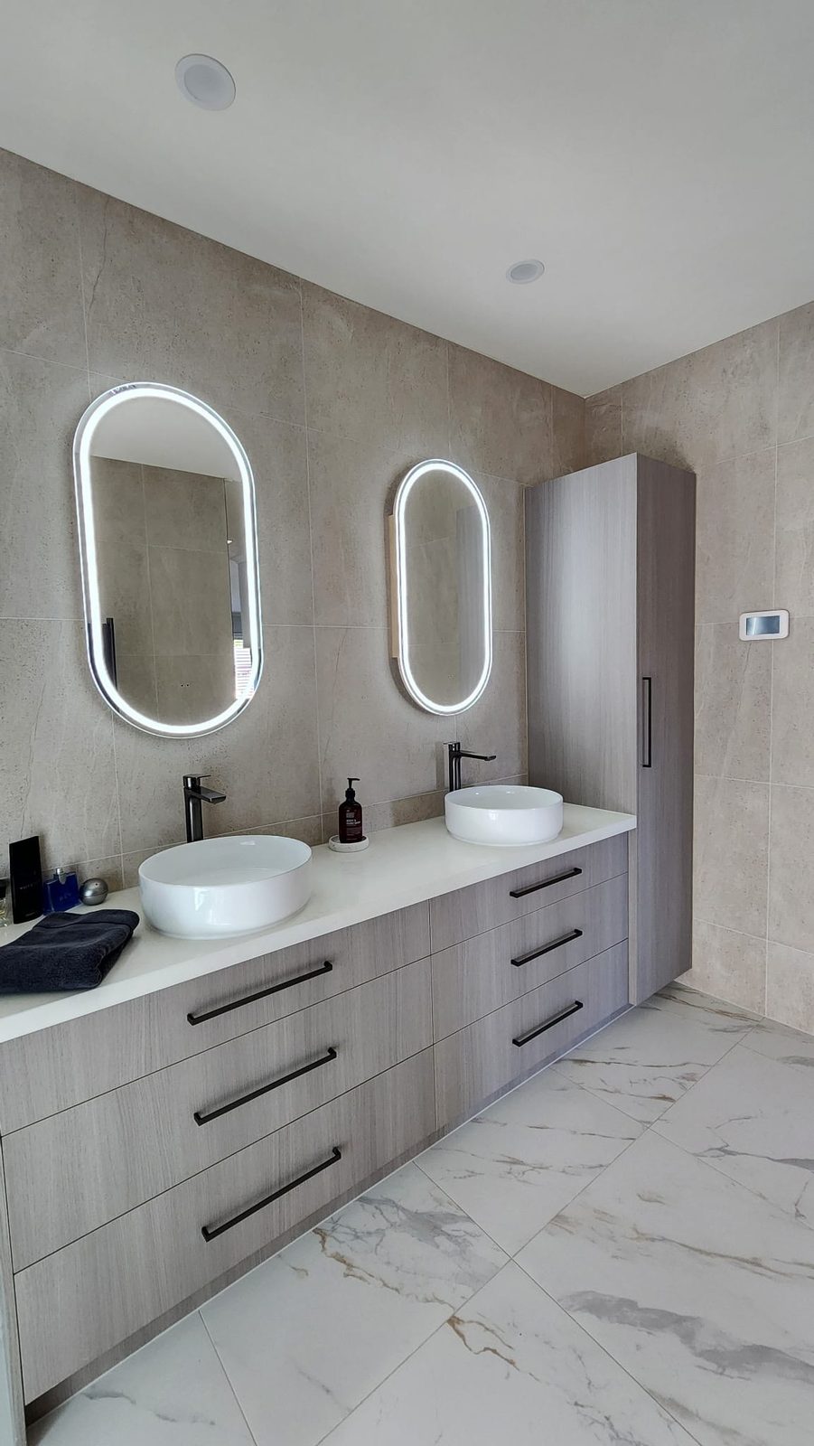 Twin round vessel basins on a double floating vanity