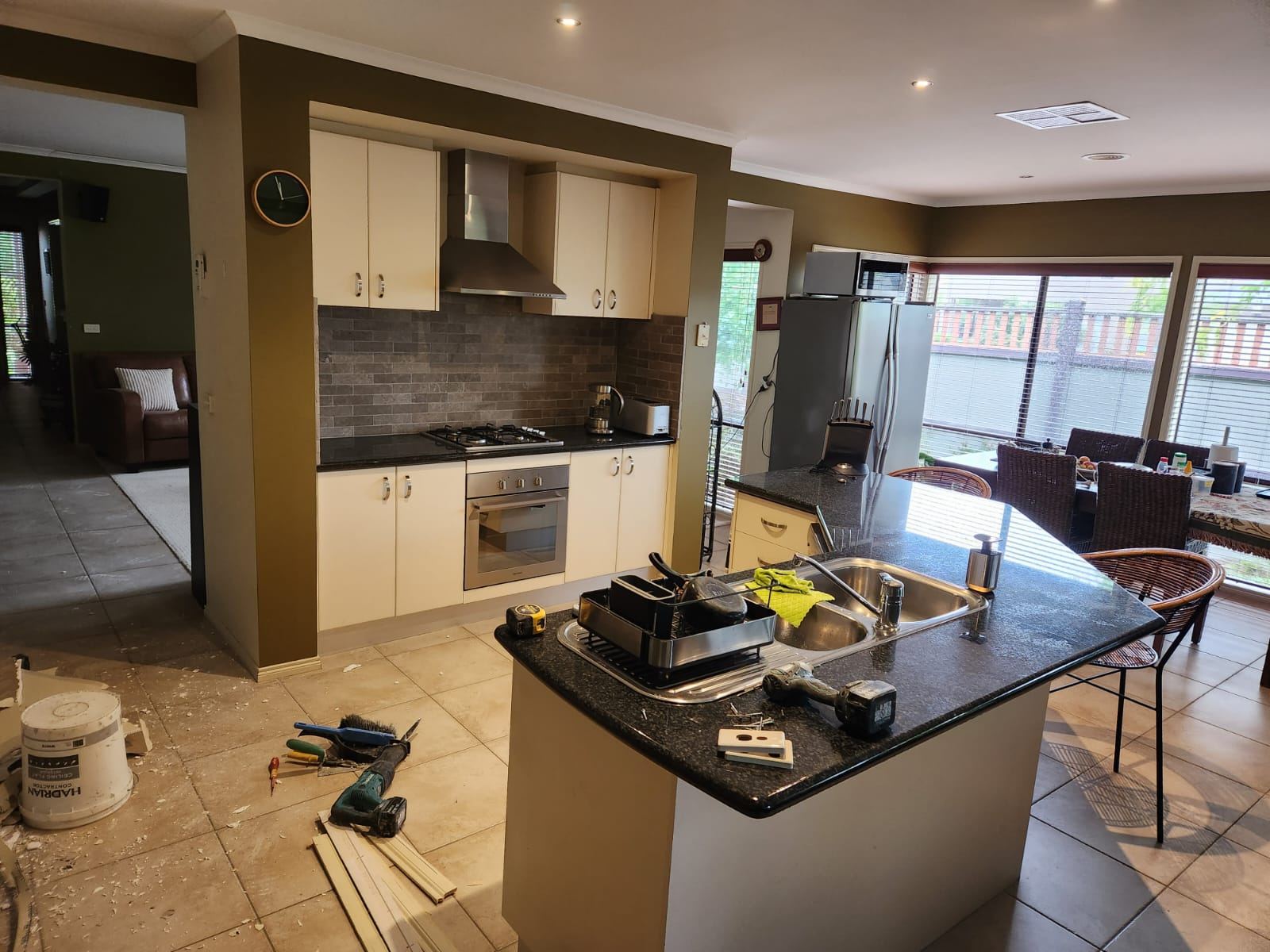 Old Point Cook kitchen before renovation, with cream cabinetry and a closed-off layout